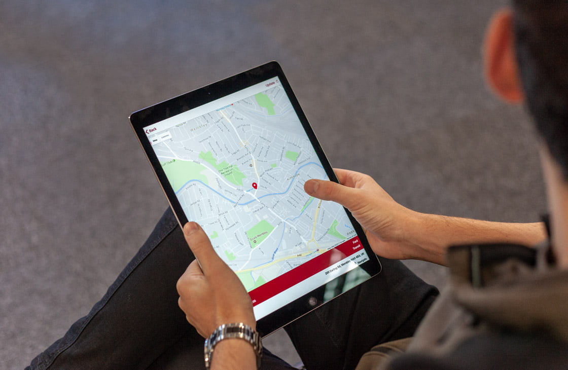 mobile app development on an ipad showing a map feature