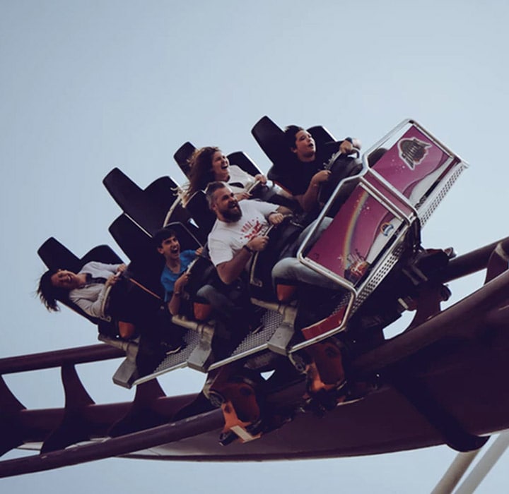 Five people going round a rollercoaster corner