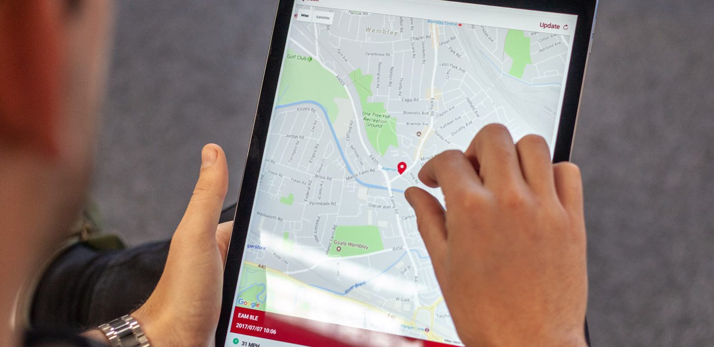 Mobile App Developer holiding ipad showing map development