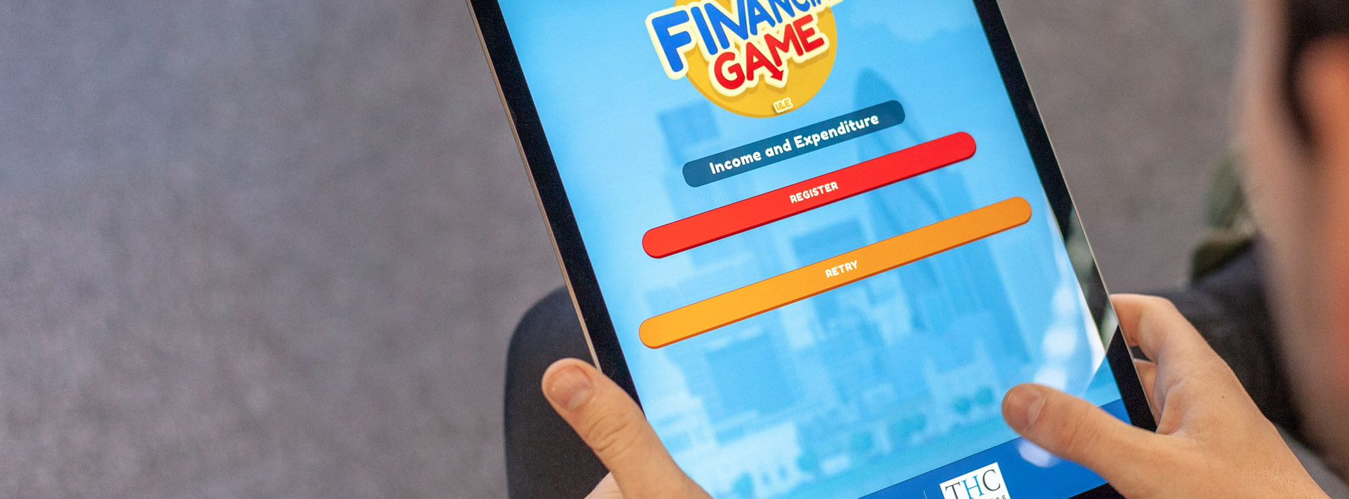 Financial game mobile app development shown on an ipad