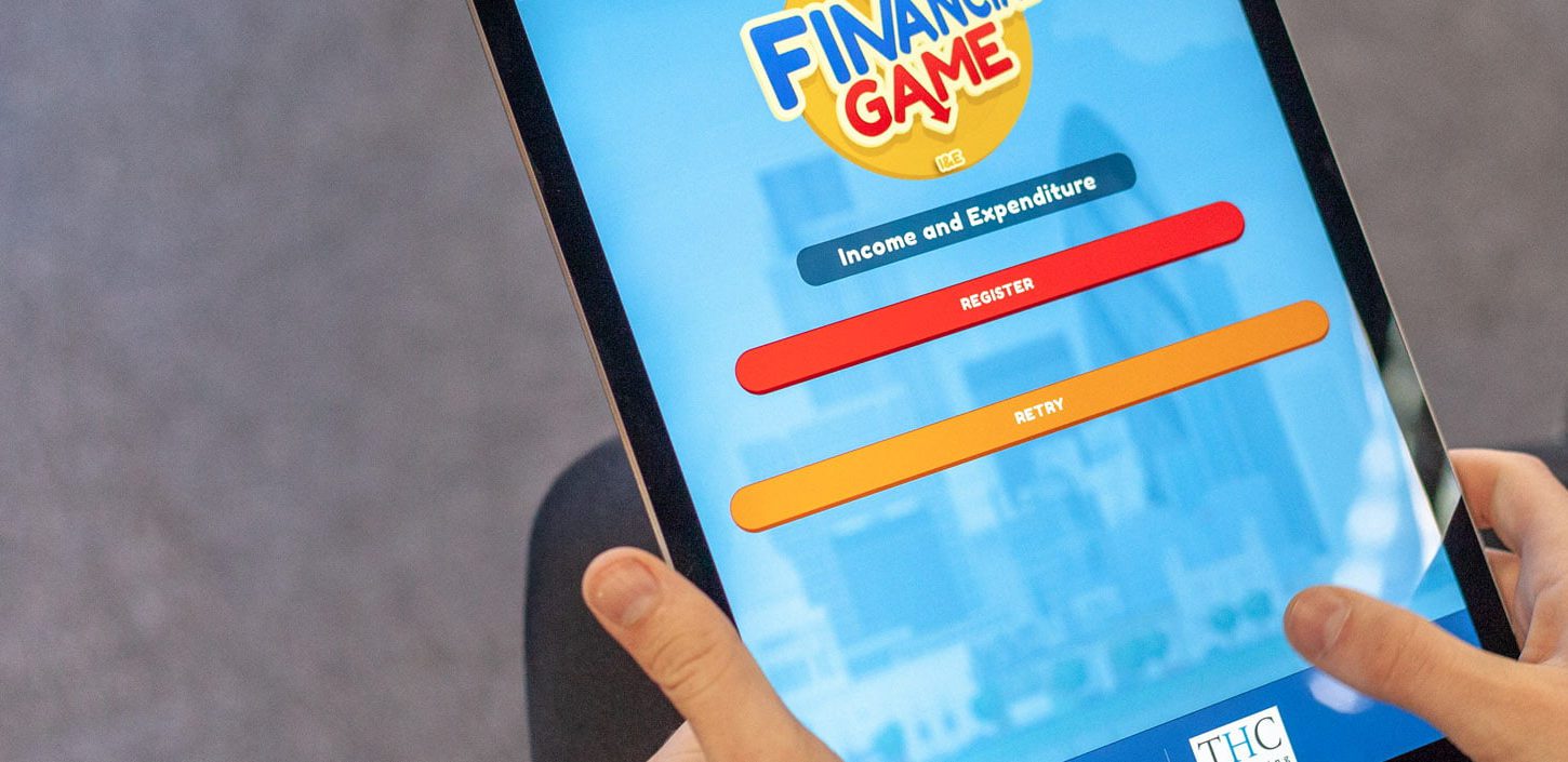 ipad showing financial game mobile app development