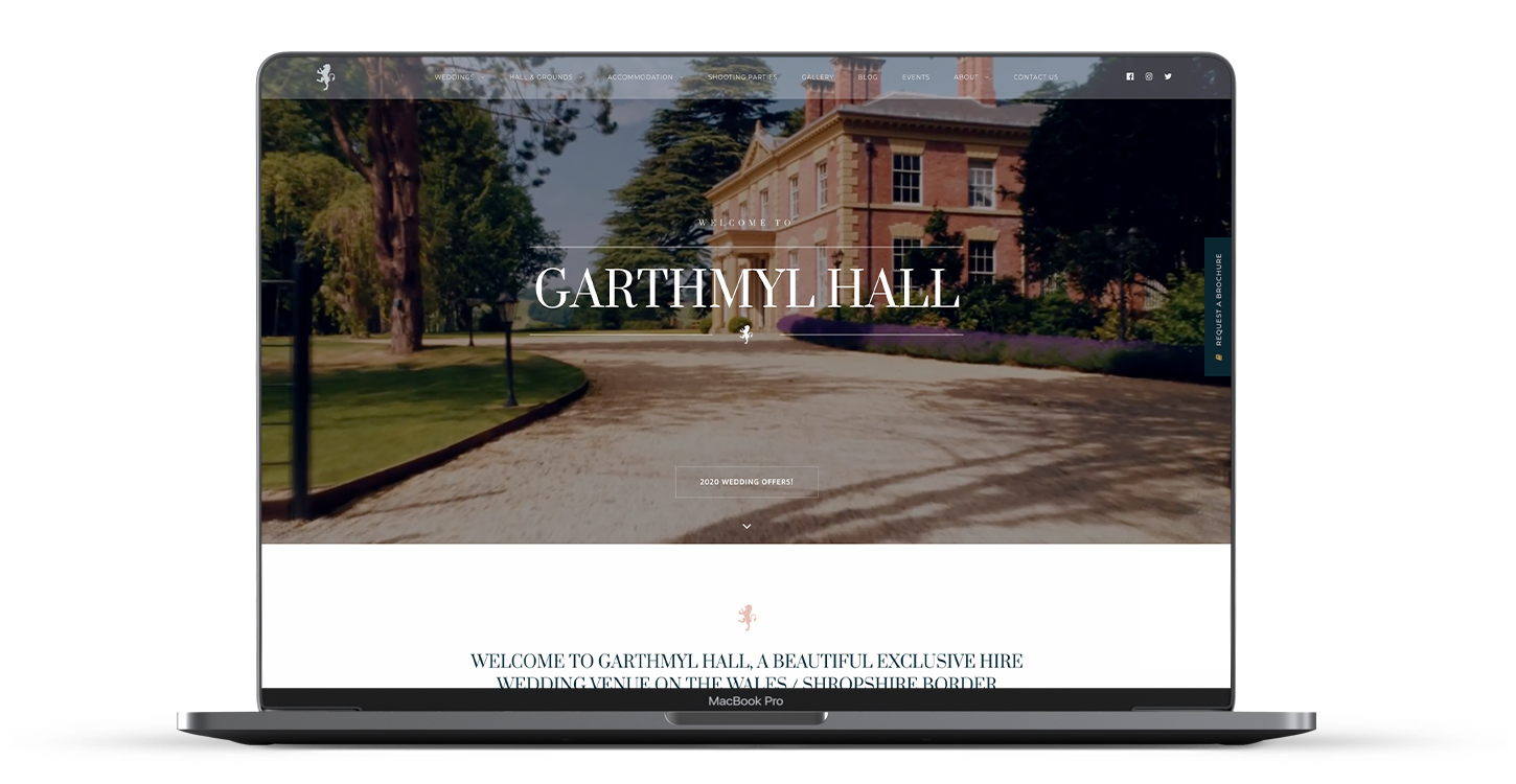 Garthmyl Hall website homepage shown on a laptop