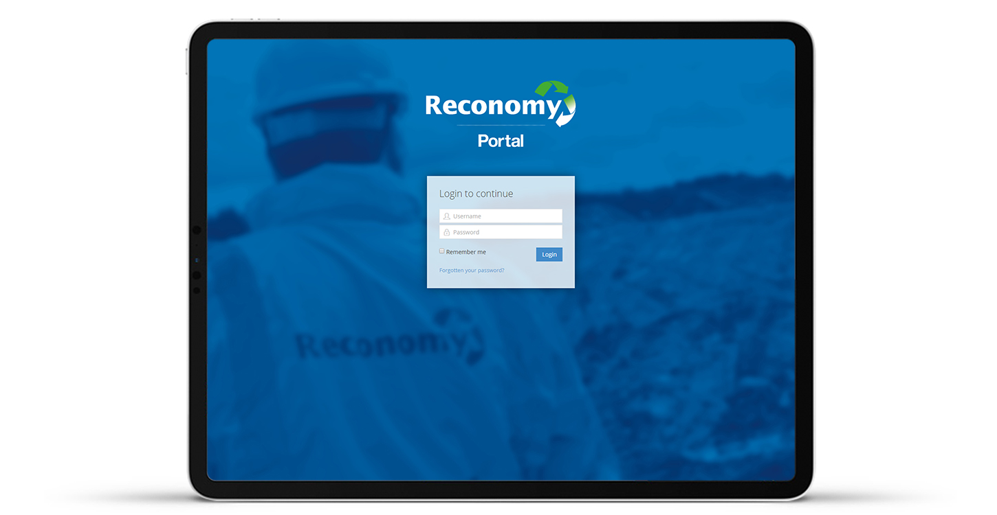 Reconomy's new blue themed login page displayed on a tablet standing upright
