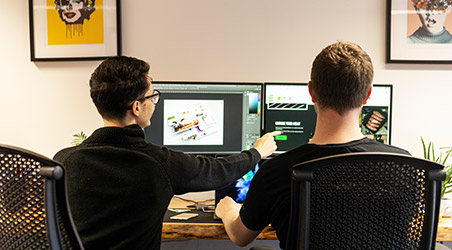 gloversure team members discussing a project at a desk