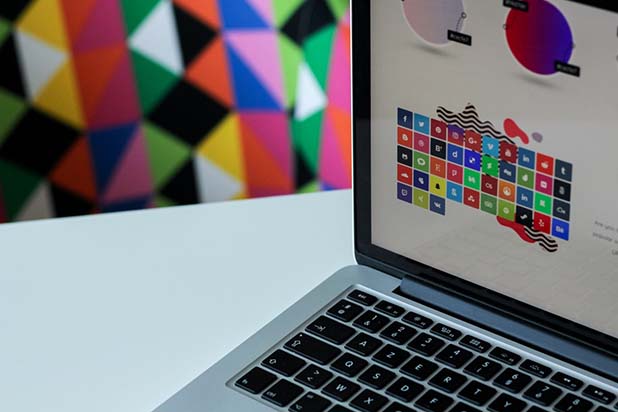 laptop showing Brand identity in Web Design, focus on colours and icons 