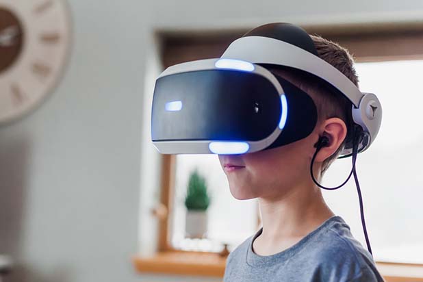 A kid wearing a VR headset in a homely living room